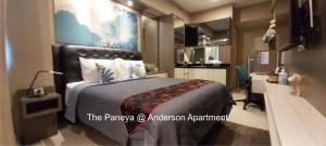 Tempat tidur dalam kamar di The Paneya@Anderson Apartment
