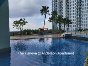 a swimming pool in the middle of a city at The Paneya@Anderson Apartment in Surabaya