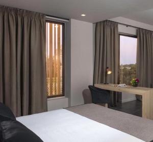 Ein Bett oder Betten in einem Zimmer der Unterkunft Azur Suites