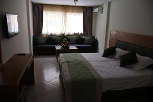 Postel nebo postele na pokoji v ubytování Hotel Residence Imiplage