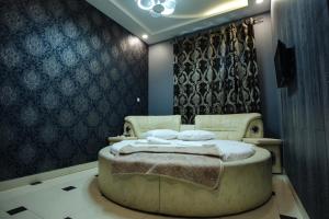 Voodi või voodid majutusasutuse GOLDEN SECONDS Hotel toas