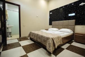 Voodi või voodid majutusasutuse GOLDEN SECONDS Hotel toas