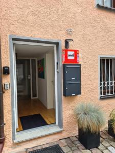 an entrance to a building with a door open at Gästeapartment Pfaff in Rottweil