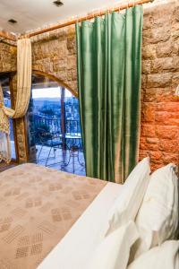 Postel nebo postele na pokoji v ubytování Vila Eden Boutique Hotel