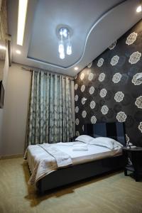 Voodi või voodid majutusasutuse GOLDEN SECONDS Hotel toas