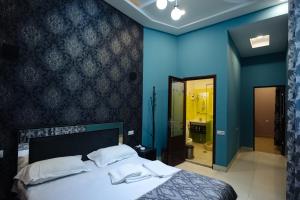 Voodi või voodid majutusasutuse GOLDEN SECONDS Hotel toas