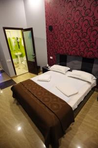 Voodi või voodid majutusasutuse GOLDEN SECONDS Hotel toas