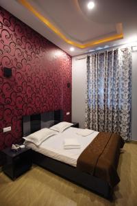 Voodi või voodid majutusasutuse GOLDEN SECONDS Hotel toas