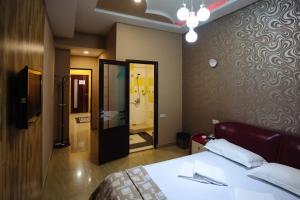 Voodi või voodid majutusasutuse GOLDEN SECONDS Hotel toas