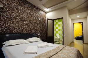 Voodi või voodid majutusasutuse GOLDEN SECONDS Hotel toas
