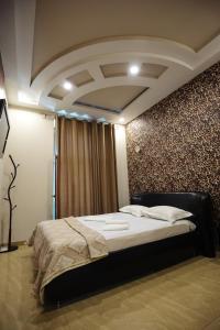Voodi või voodid majutusasutuse GOLDEN SECONDS Hotel toas