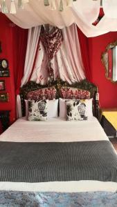 מיטה או מיטות בחדר ב-Casa Ronda 1808