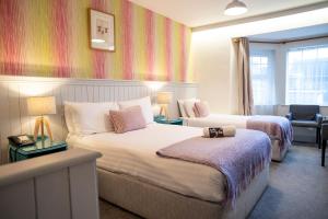 Letto o letti in una camera di Emmet Hotel