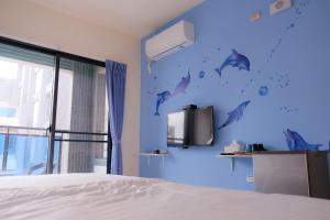 Uma cama ou camas num quarto em Baby Dolphin