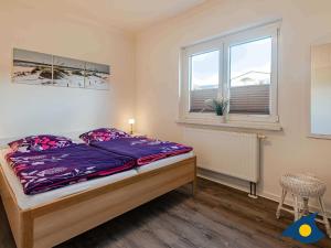 Postel nebo postele na pokoji v ubytování Haus Moewe Whg 01