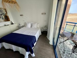 Postel nebo postele na pokoji v ubytování Casa del Castillo