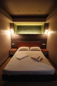 Voodi või voodid majutusasutuse GOLDEN SECONDS Hotel toas