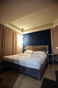 Voodi või voodid majutusasutuse GOLDEN SECONDS Hotel toas