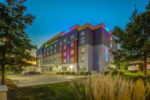 a rendering of a building with lights on it at Holiday Inn Express Hotel & Suites - Woodstock, an IHG Hotel in Woodstock