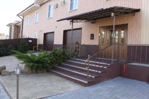 a house with a staircase leading to the front door at Art-Room "Чистые ключи" in Yaroslavl