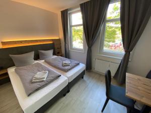 Postel nebo postele na pokoji v ubytování Hostel Harzer Hof + 37 fotografií