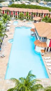 an overhead view of a swimming pool at a resort at Casa Duplex 3 suítes em Condomínio Fechado in Porto Seguro