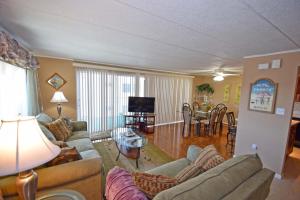 a living room with couches and a dining room at Thunder Island 75B condo in Ocean City