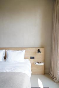 Postel nebo postele na pokoji v ubytování Hotel âme