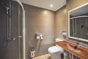 a bathroom with a shower and a toilet and a sink at Santa Ponsa Pins in Santa Ponsa