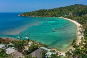 an aerial view of a beach with boats in the water at Cookies Salad Resort in Salad Beach