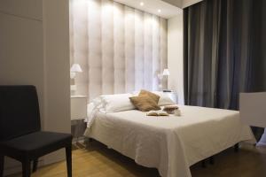 Postel nebo postele na pokoji v ubytování Piccolo Mondo Hotel