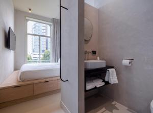 Postel nebo postele na pokoji v ubytování Hotel âme