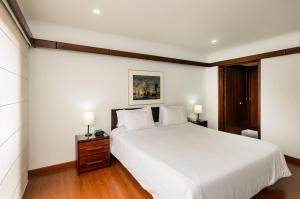 Cama o camas de una habitación en Travelers Condominio Plenitud