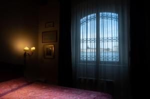 Posteľ alebo postele v izbe v ubytovaní Giudecca Molino Stucky