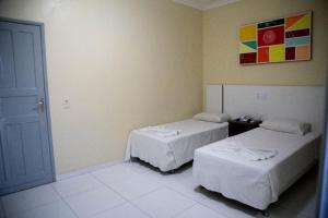 Postel nebo postele na pokoji v ubytování Hotel Capuchins