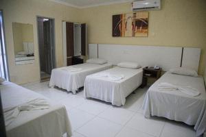 Postel nebo postele na pokoji v ubytování Hotel Capuchins