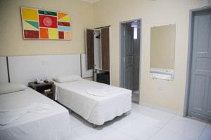 Postel nebo postele na pokoji v ubytování Hotel Capuchins