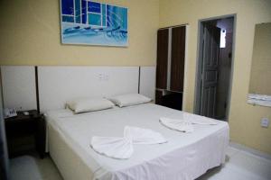 Postel nebo postele na pokoji v ubytování Hotel Capuchins