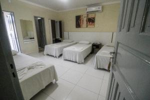 Postel nebo postele na pokoji v ubytování Hotel Capuchins