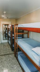 Säng eller sängar i ett rum på Hostel Paraíso