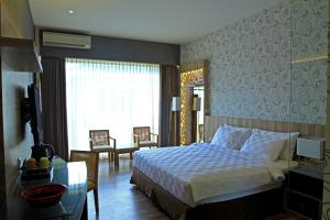 Postel nebo postele na pokoji v ubytování Oxville Hotel