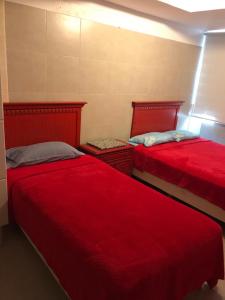 Ένα ή περισσότερα κρεβάτια σε δωμάτιο στο Acapulco María Bonita - Alberca Abierta - A Pie de Playa