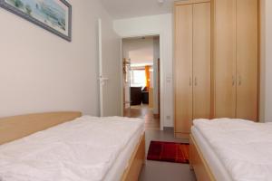 Postel nebo postele na pokoji v ubytování Residenz am Strand Wohnung 4-59