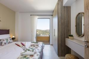 A bed or beds in a room at Villa Zoe , south Crete , Triopetra