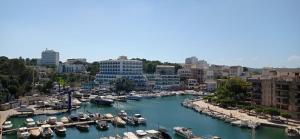 a harbor filled with lots of boats in the water at Porto Drach Aparthotel & Suites in Porto Cristo