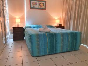 Postel nebo postele na pokoji v ubytování Mango Tree Holiday Apartments