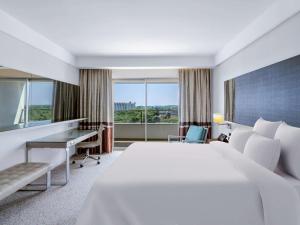 a hotel room with a bed and a desk at Rixos Premium Belek - The Land of Legends Access in Belek