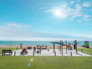a playground on the beach with the ocean in the background at Rixos Premium Belek - The Land of Legends Access in Belek