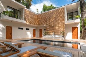 an external view of a house with a swimming pool at Nala Luxury Living - Santa Teresa - Costa Rica in Santa Teresa Beach