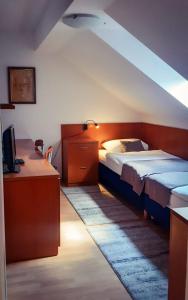 Кровать или кровати в номере Pansion Danica